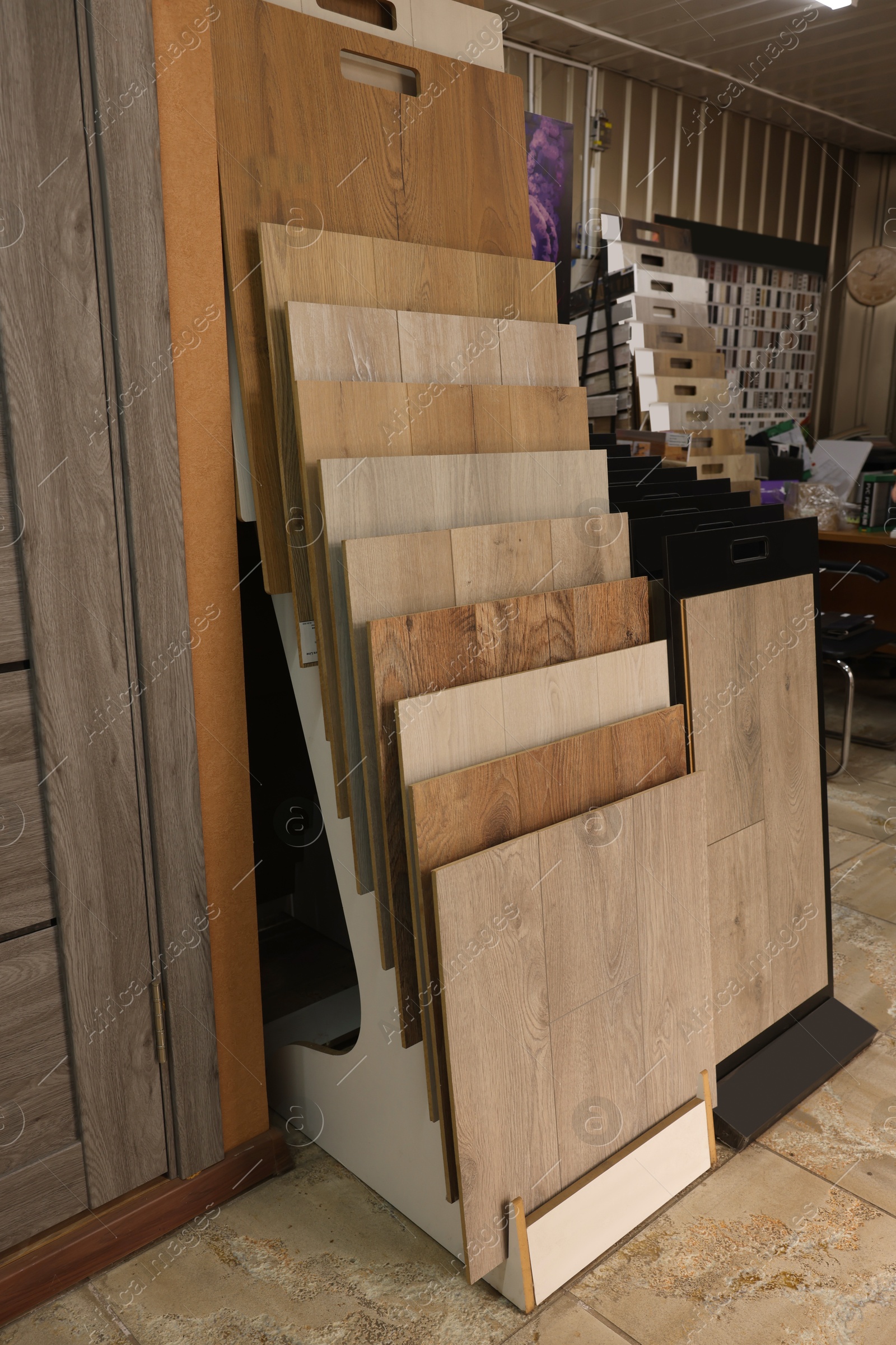 Photo of Many different samples of wooden flooring in store