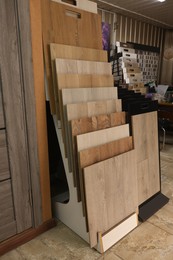 Photo of Many different samples of wooden flooring in store