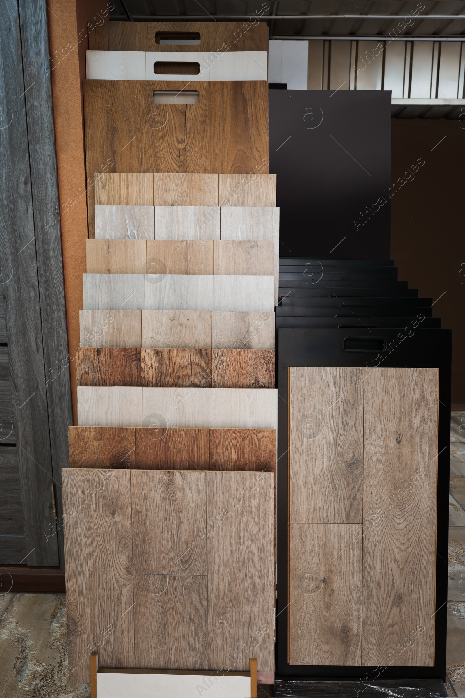 Photo of Many different samples of wooden flooring in store