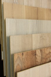 Photo of Many different samples of wooden flooring in store