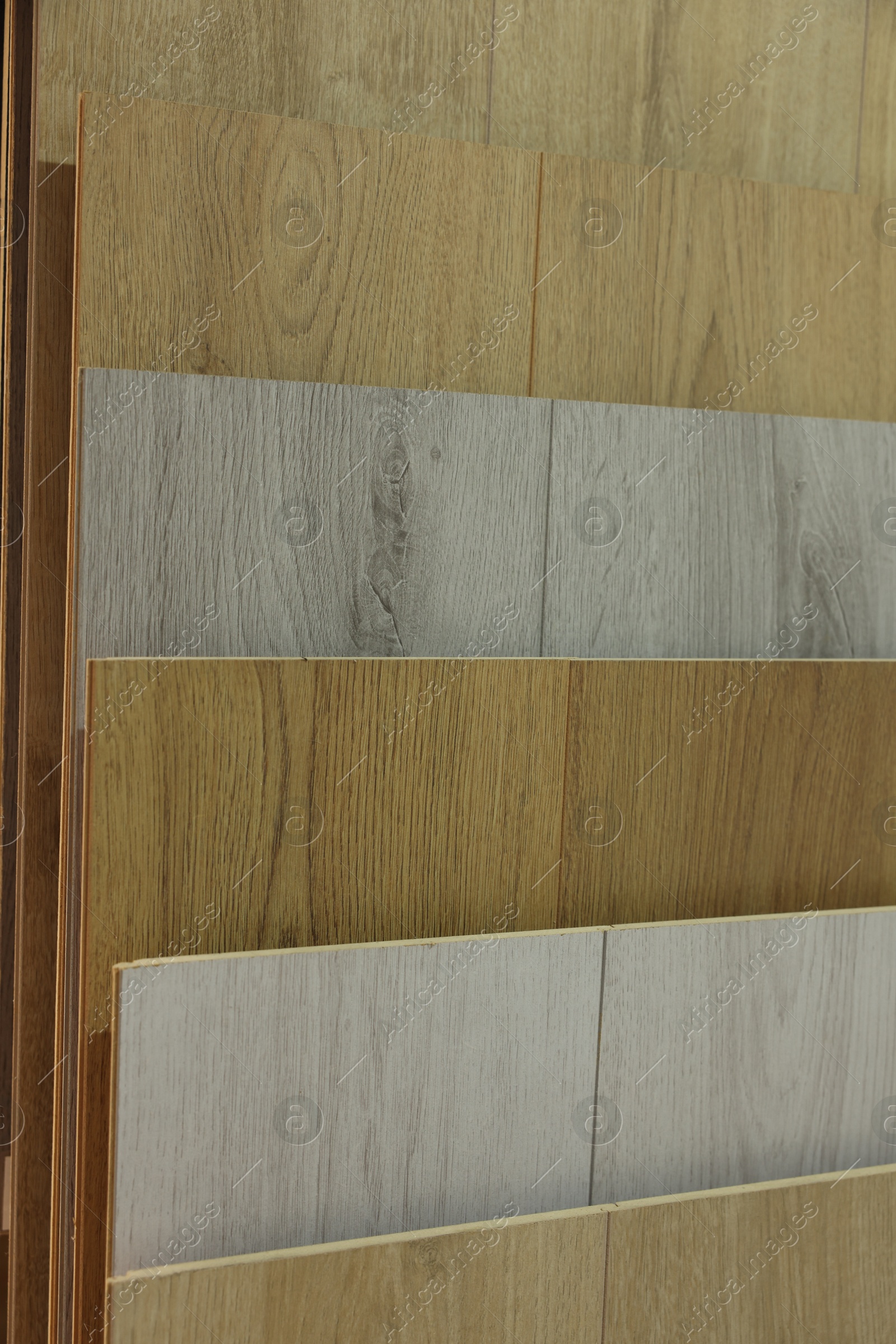 Photo of Many different samples of wooden flooring in store