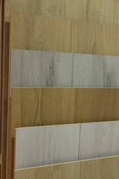 Photo of Many different samples of wooden flooring in store