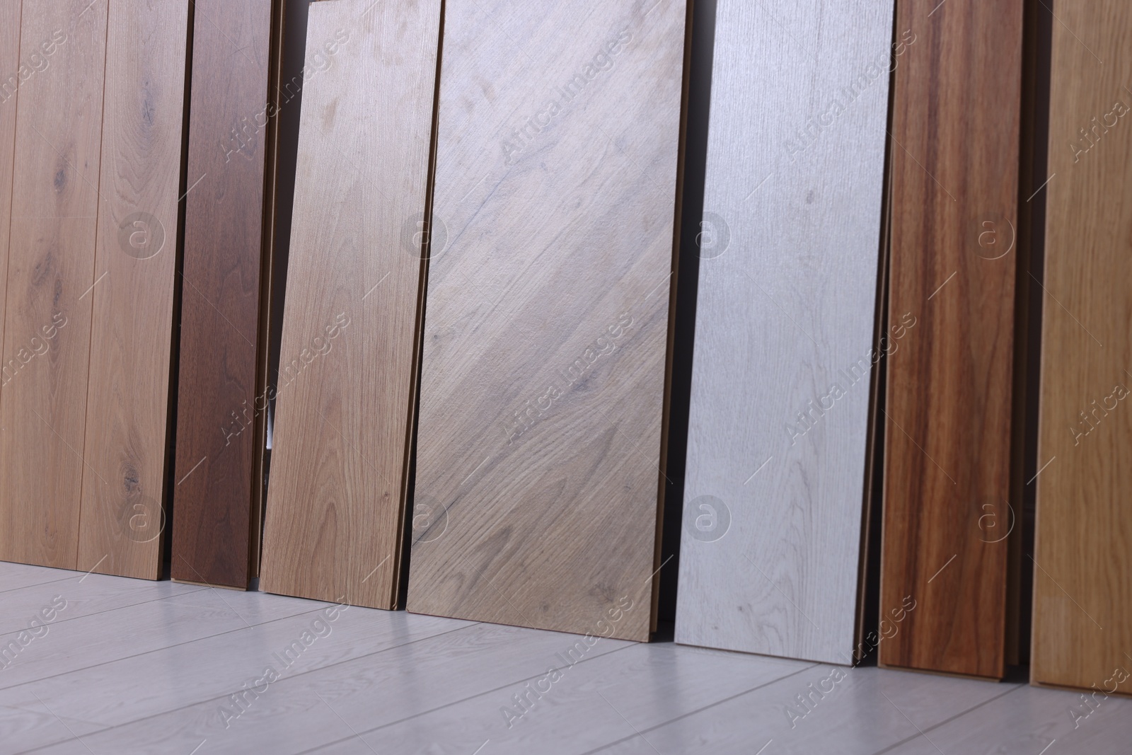 Photo of Many different samples of wooden flooring in store