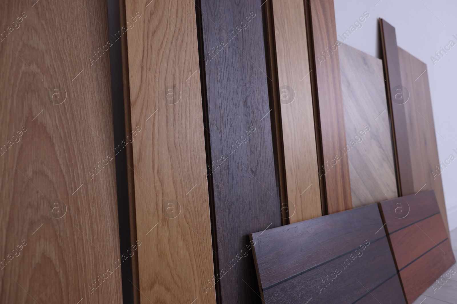 Photo of Many different samples of wooden flooring in store