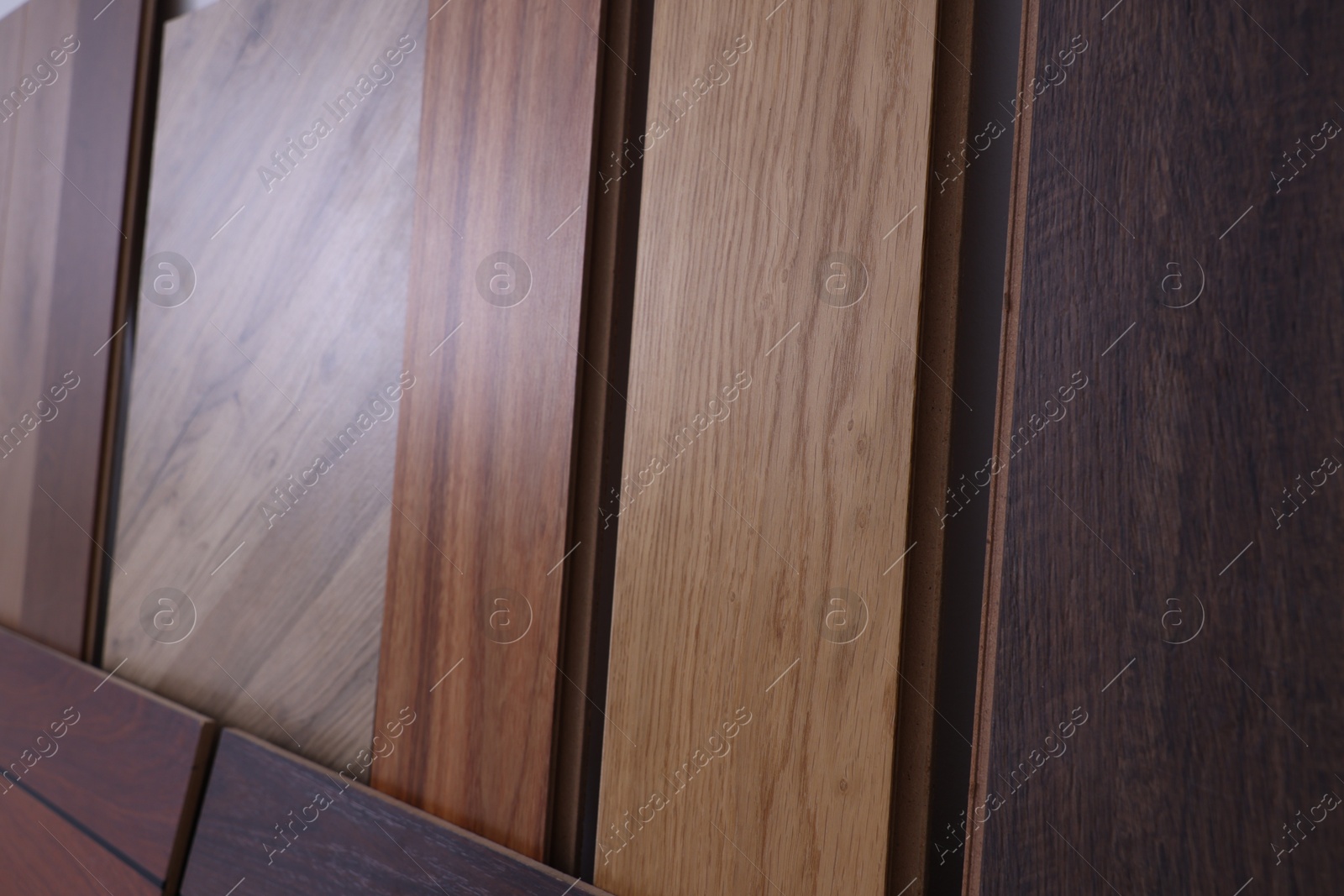 Photo of Many different samples of wooden flooring in store