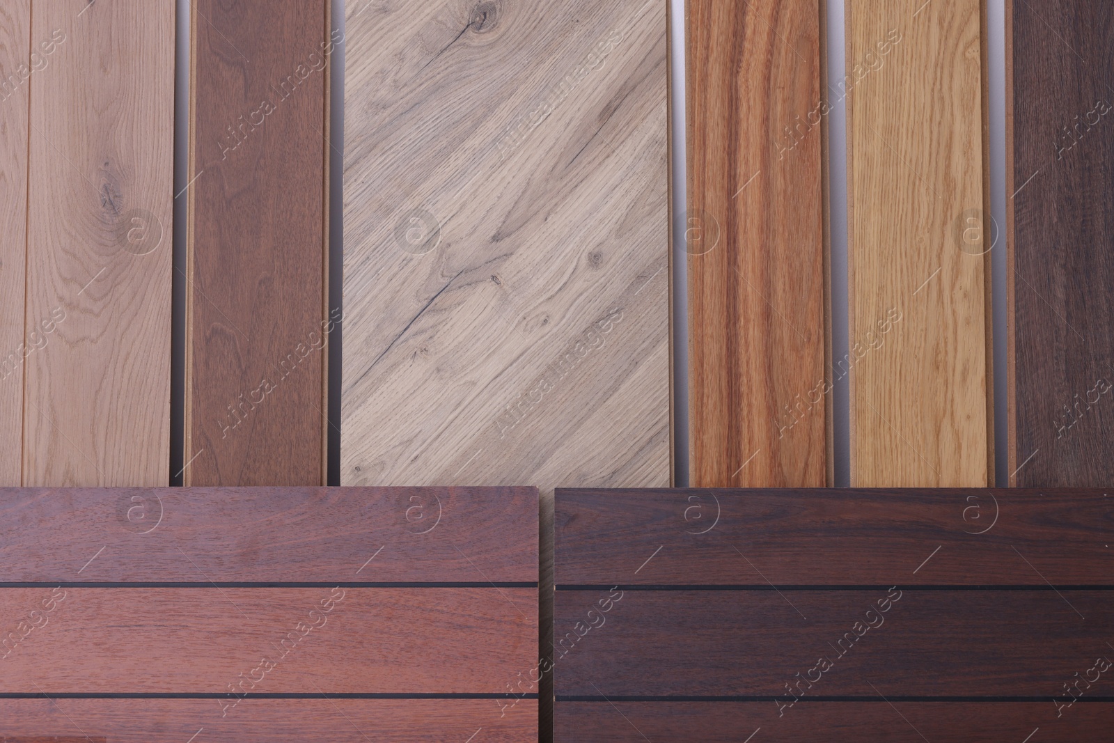 Photo of Many different samples of wooden flooring in store