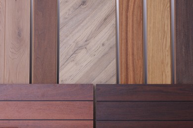 Photo of Many different samples of wooden flooring in store