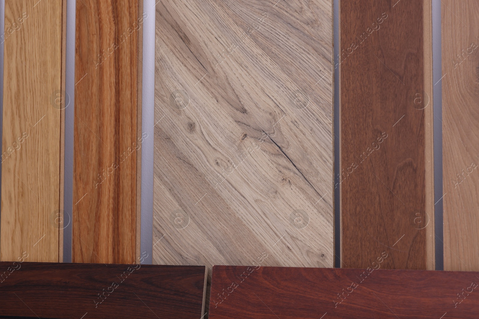 Photo of Many different samples of wooden flooring in store