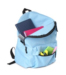 Photo of Backpack with different school stationery isolated on white