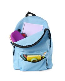 Backpack with different school stationery isolated on white