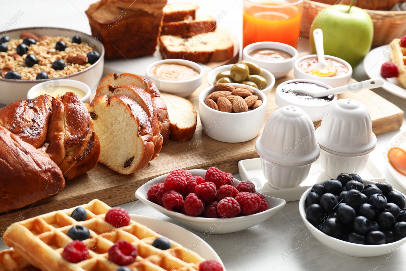 Photo of Different meals served for breakfast on white table