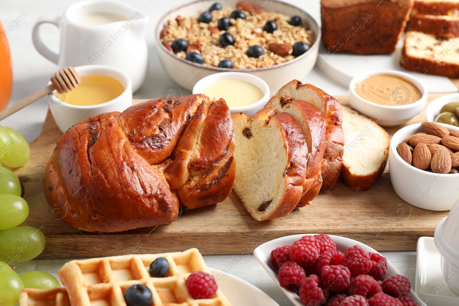 Photo of Different meals served for breakfast on white table