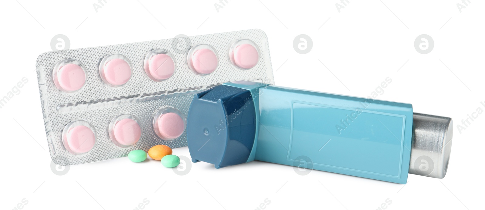 Photo of Asthma treatment. Inhaler and pills isolated on white