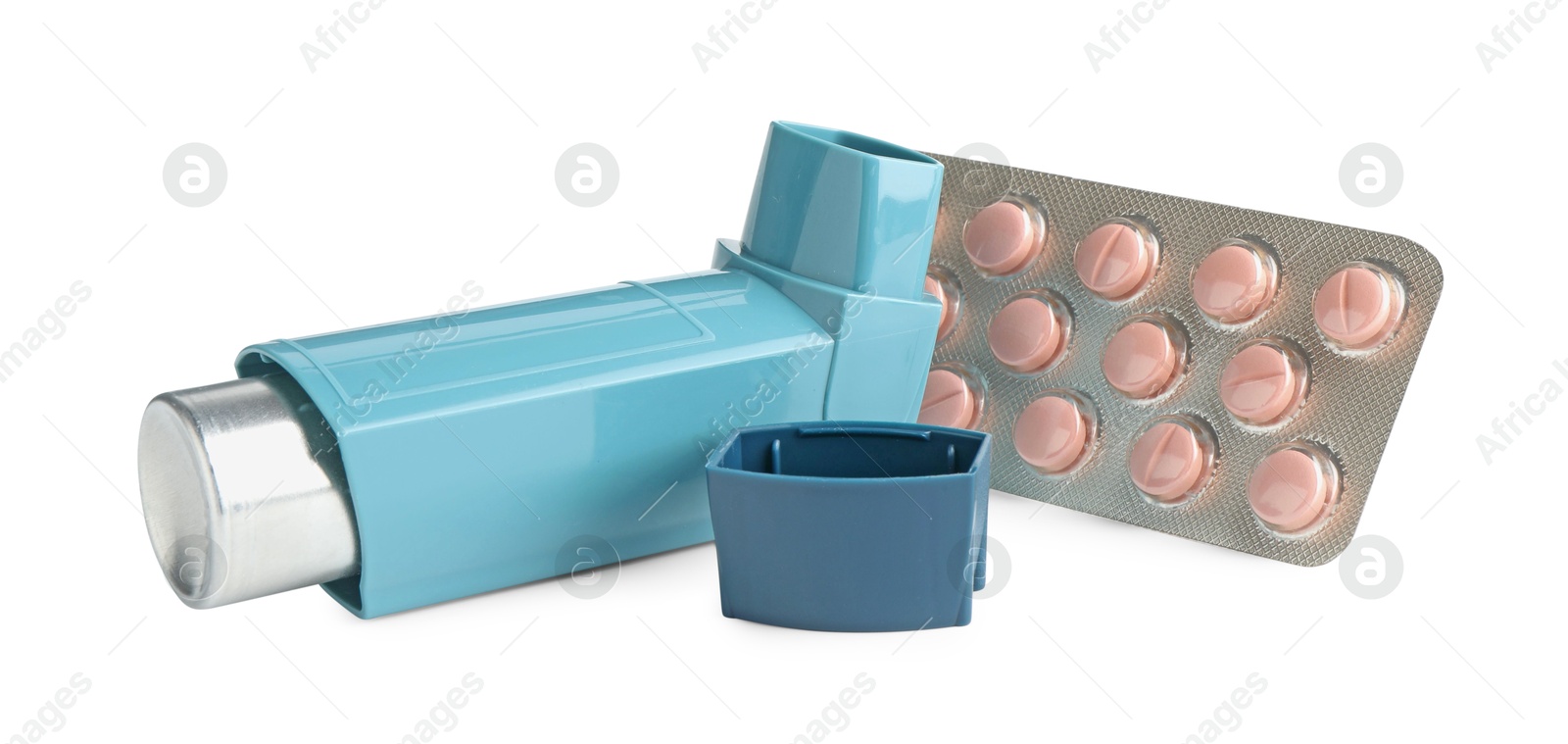 Photo of Asthma treatment. Inhaler and pills isolated on white