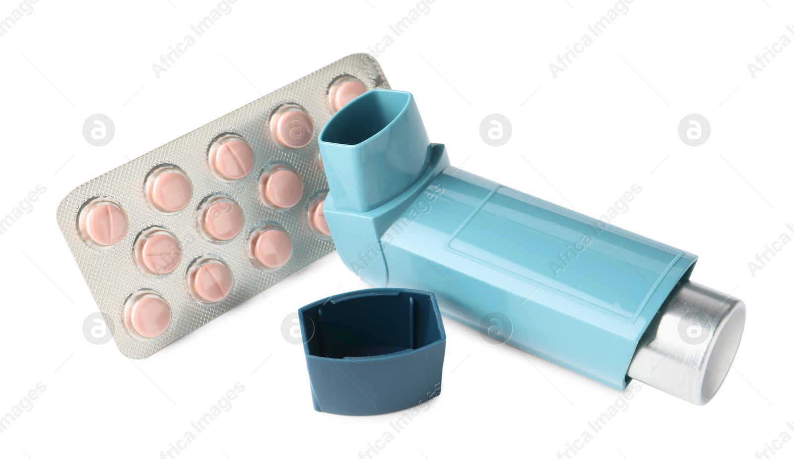 Photo of Asthma treatment. Inhaler and pills isolated on white