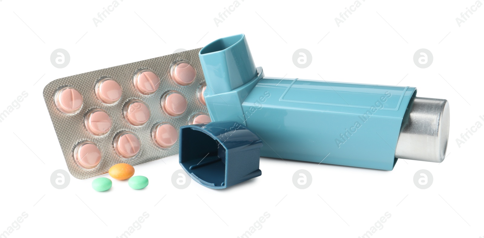 Photo of Asthma treatment. Inhaler and pills isolated on white