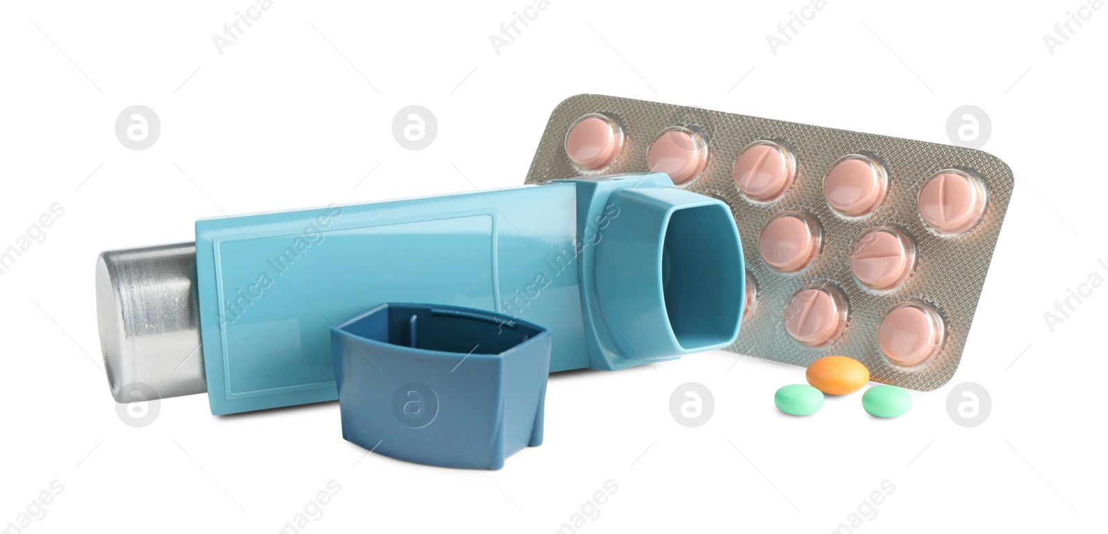 Photo of Asthma treatment. Inhaler and pills isolated on white