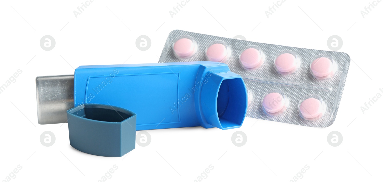 Photo of Asthma treatment. Inhaler and pills isolated on white