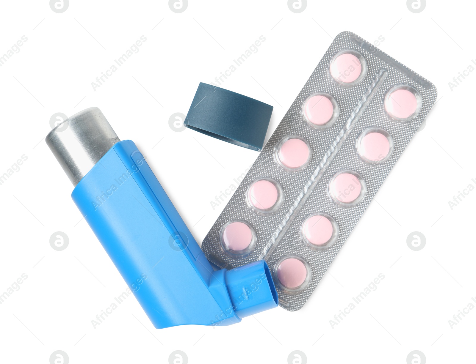 Photo of Asthma treatment. Inhaler and pills isolated on white, top view