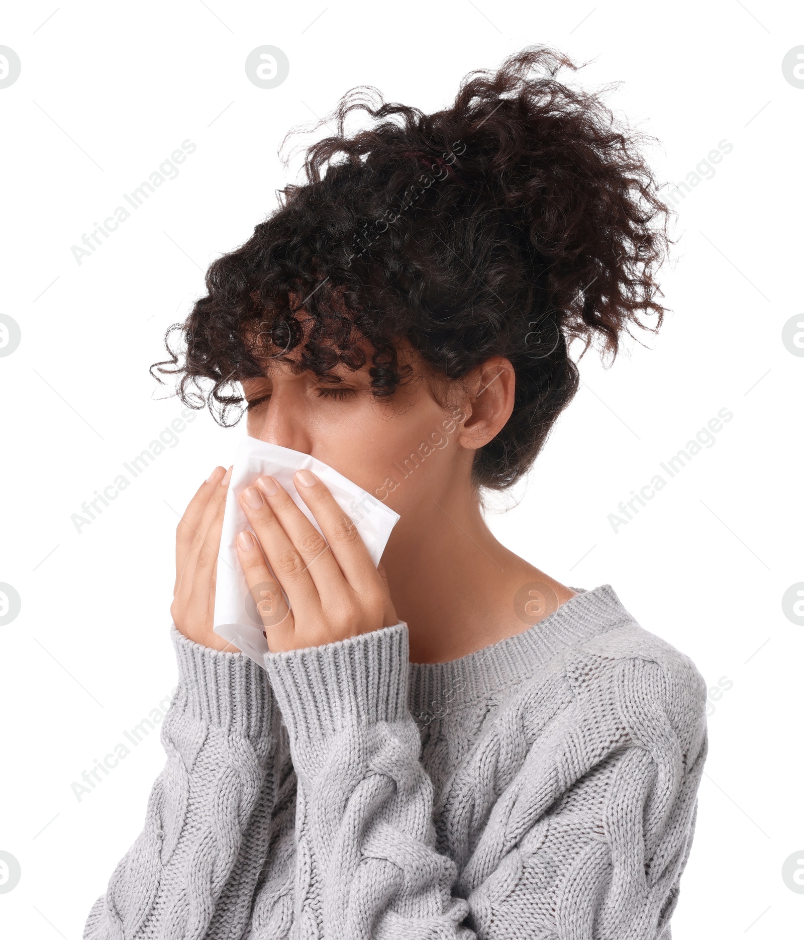 Photo of Cold symptom. Young woman with tissue on white background