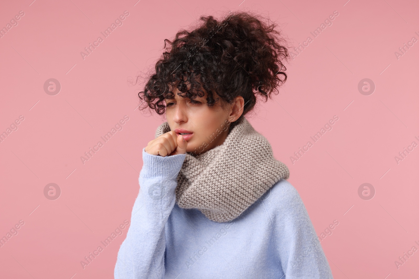 Photo of Cold symptom. Young woman suffering from illness on pink background