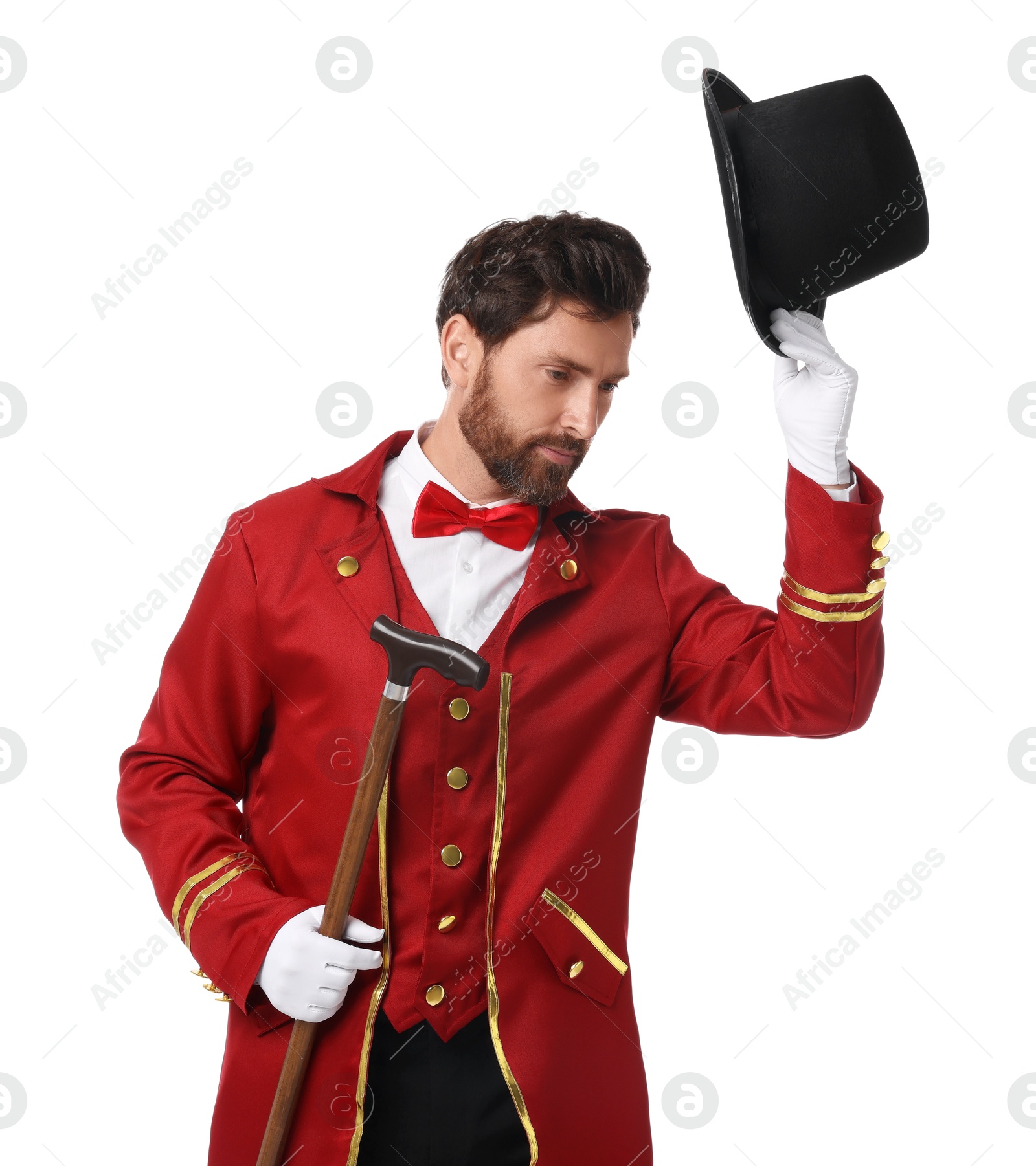 Photo of Portrait of showman in red costume and hat on white background