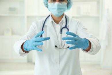 Doctor holding something in clinic, selective focus