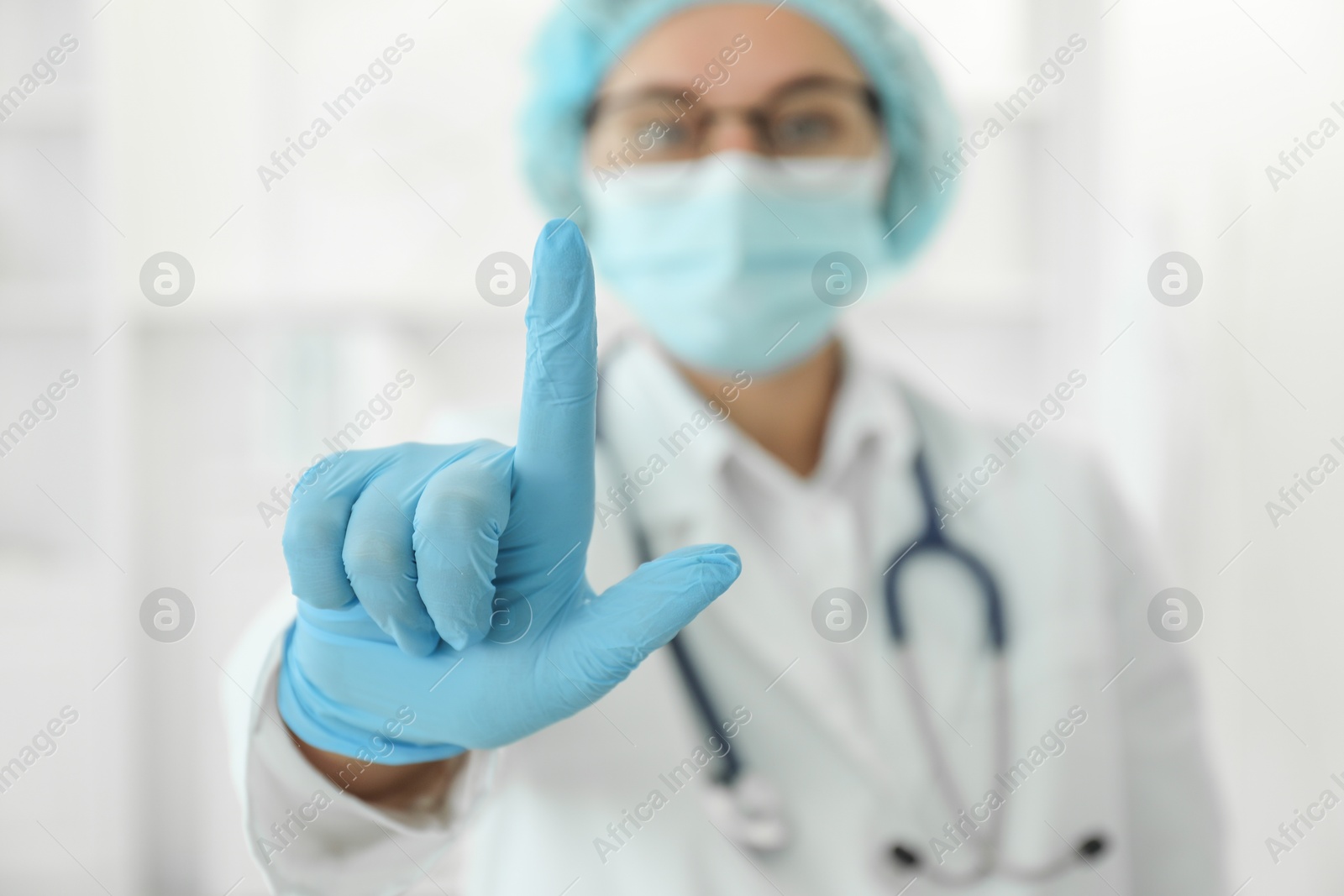 Photo of Doctor pointing at something in clinic, selective focus. Space for text