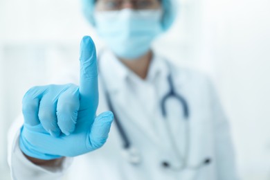 Photo of Doctor pointing at something in clinic, closeup view. Space for text