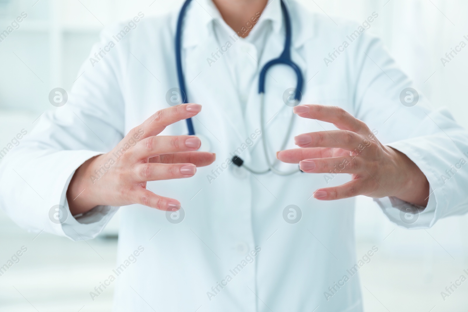 Photo of Doctor holding something in clinic, closeup view