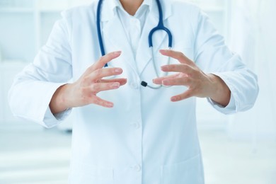 Photo of Doctor holding something in clinic, closeup view