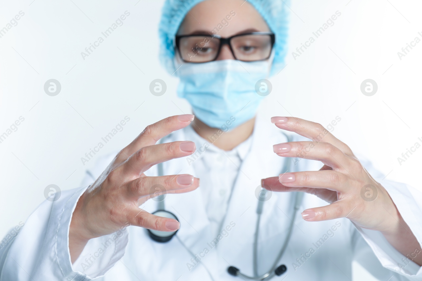 Photo of Doctor holding something on white background, selective focus