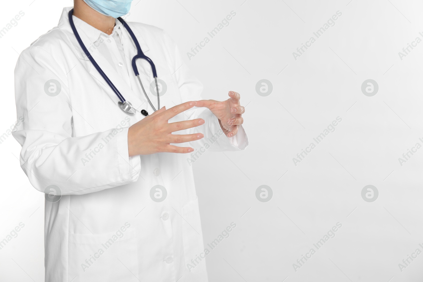 Photo of Doctor holding something on white background, closeup. Space for text