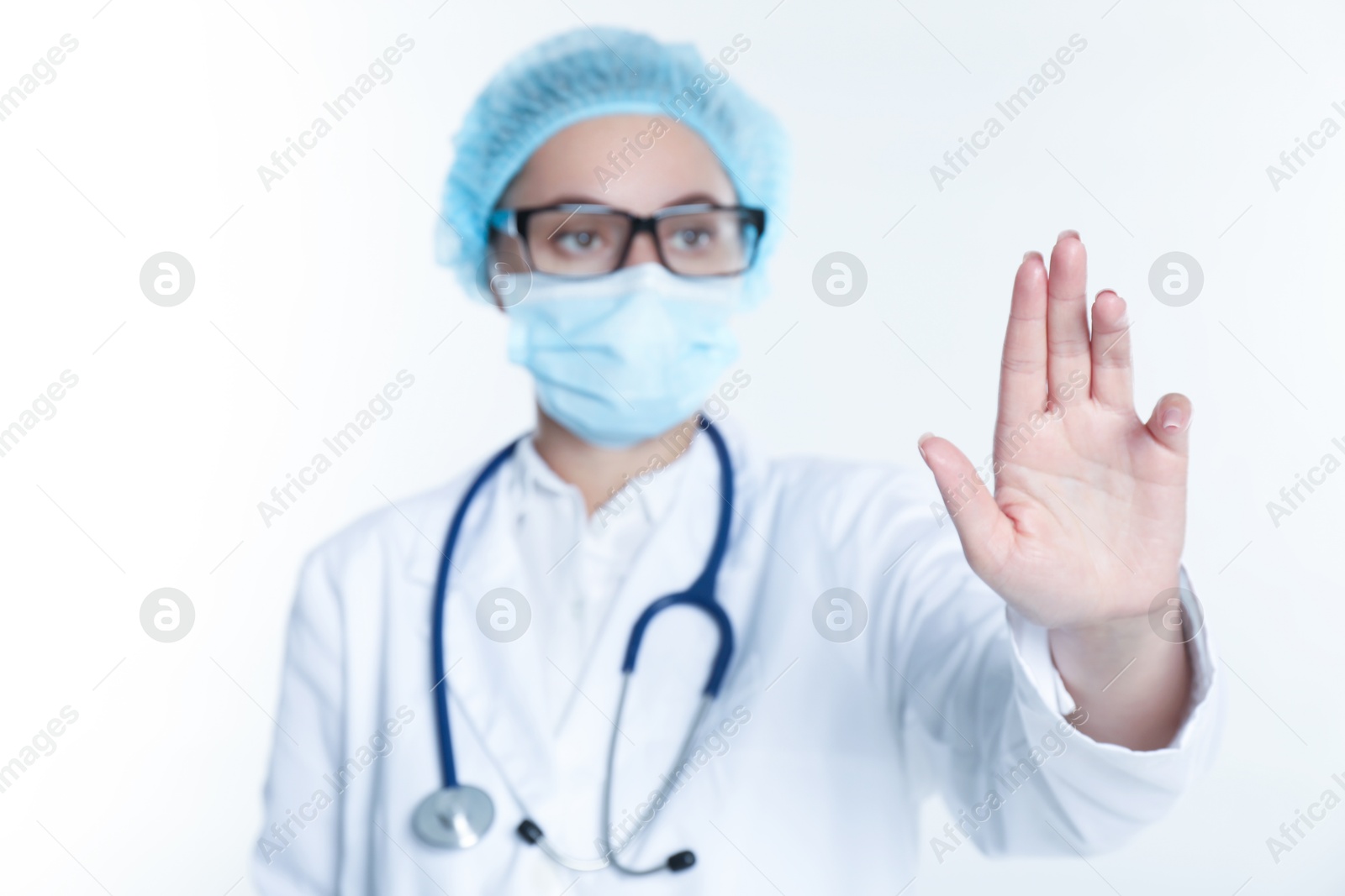 Photo of Doctor touching something on white background, selective focus