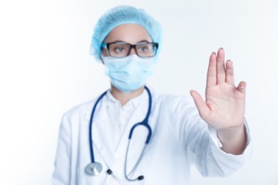 Photo of Doctor touching something on white background, selective focus