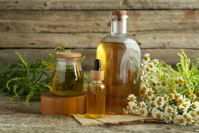 Photo of Tinctures and medicinal herbs on wooden table