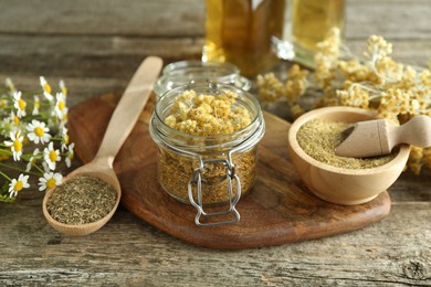 Photo of Different ingredients for tincture on wooden table