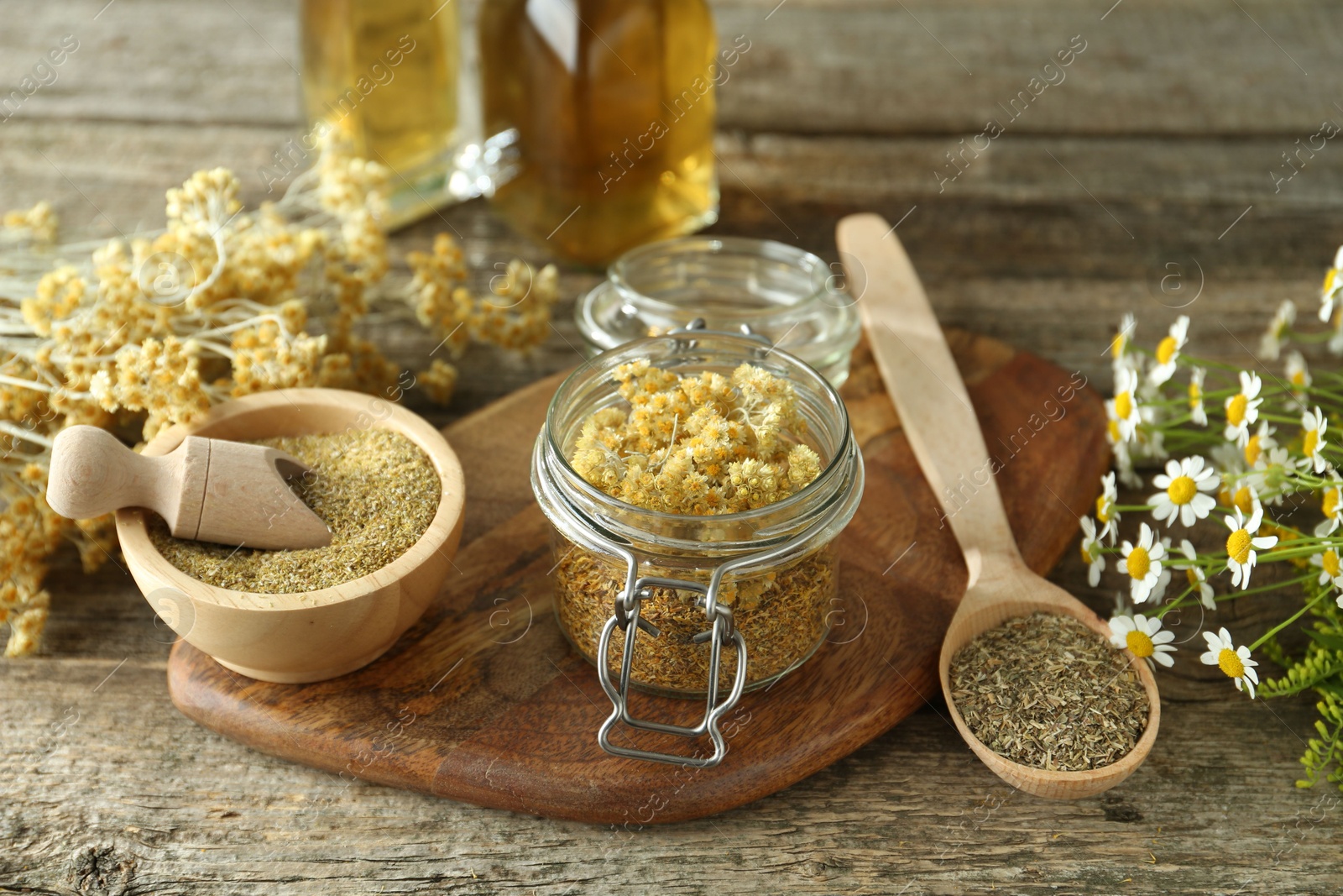 Photo of Different ingredients for tincture on wooden table