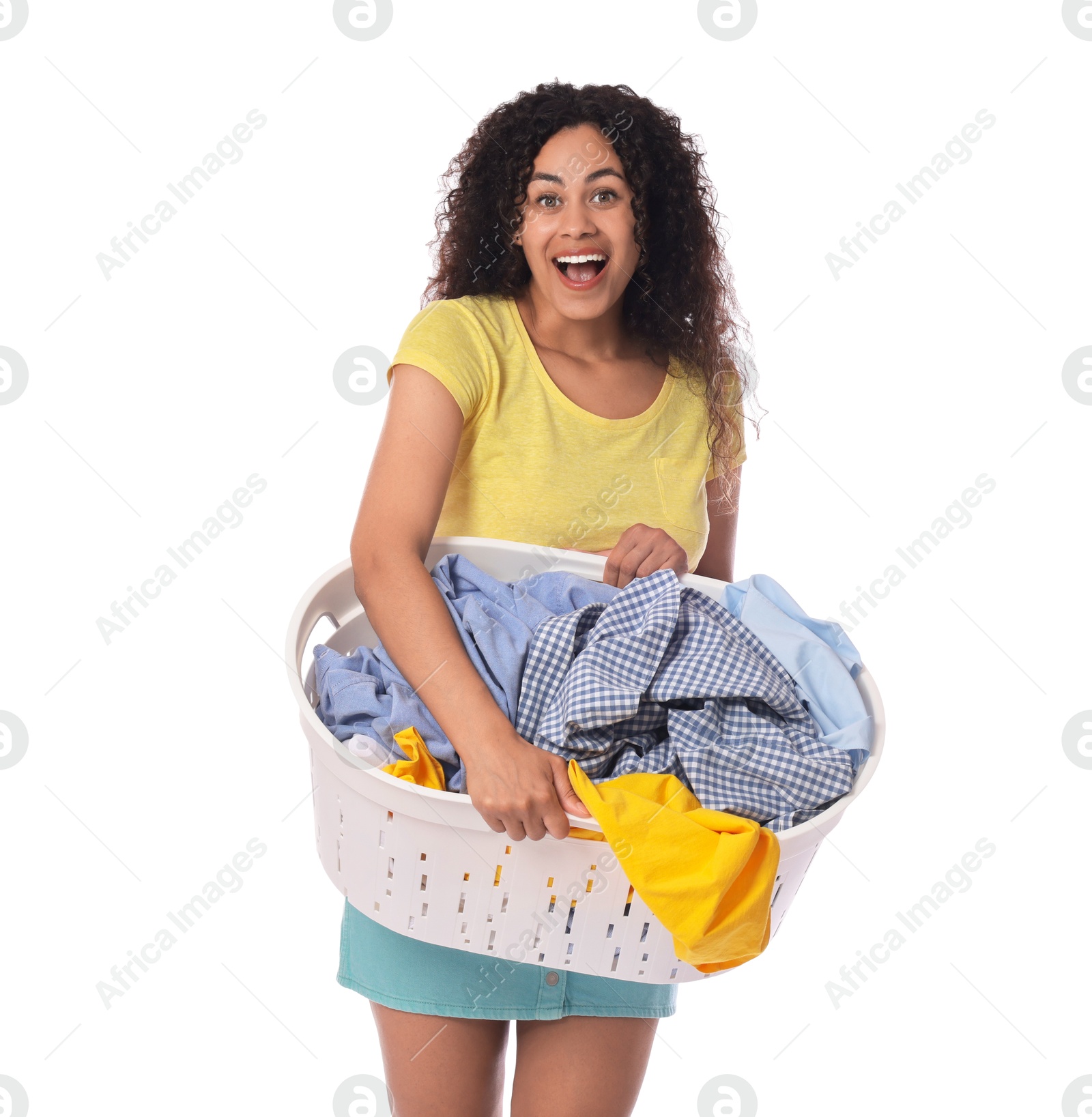 Photo of Happy woman with basket full of laundry on white background