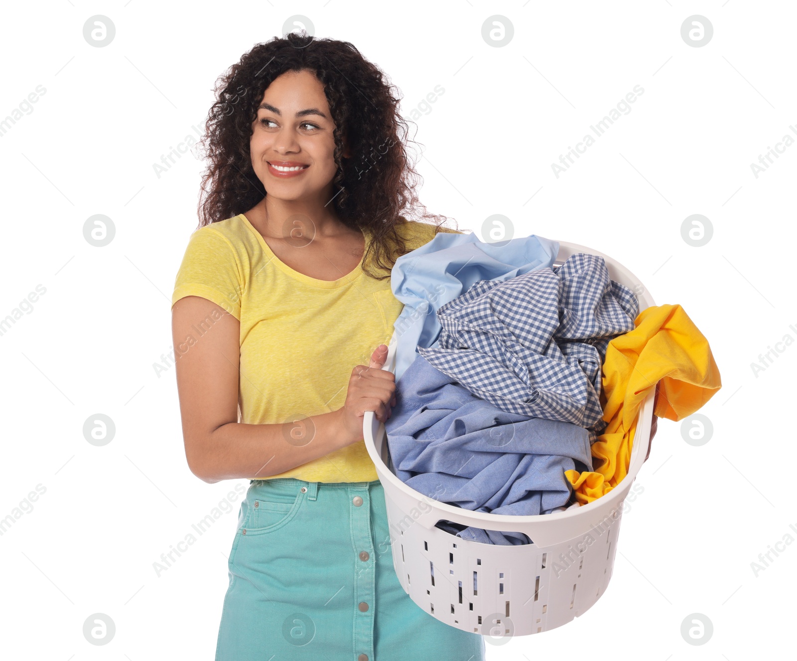 Photo of Happy woman with basket full of laundry on white background