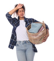 Tired woman with basket full of laundry on white background