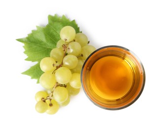 Tasty juice in glass, fresh grapes and leaf isolated on white, top view