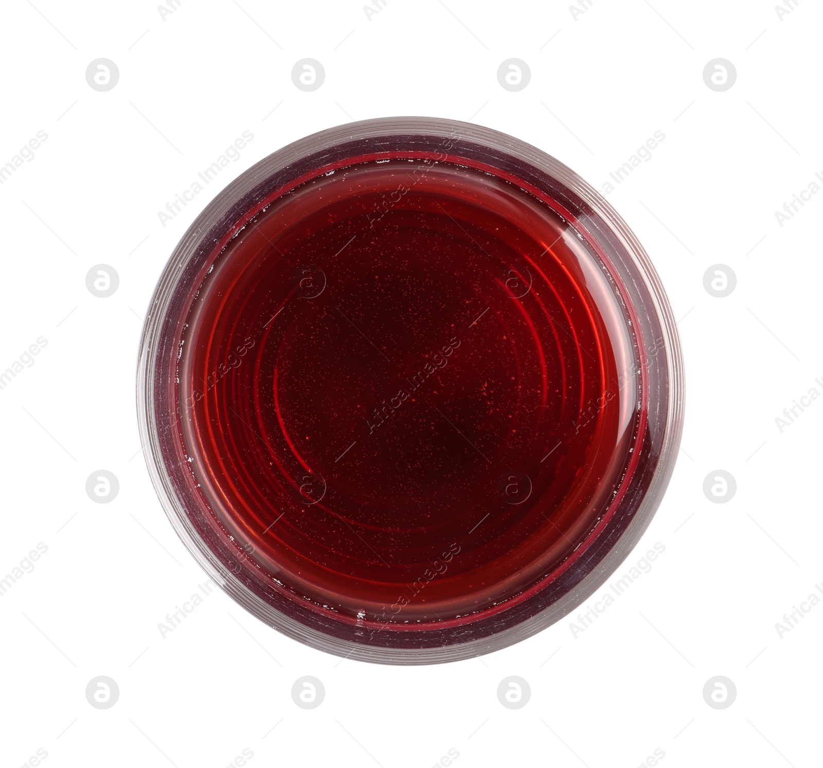 Photo of Tasty grape juice in glass isolated on white, top view