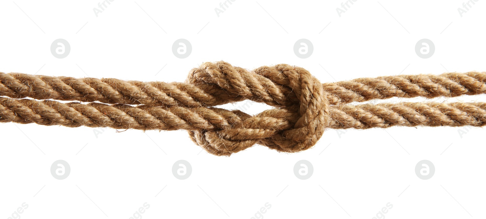 Photo of Hemp rope with square knot on white background