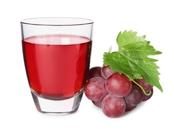 Photo of Tasty grape juice in glass, leaf and berries isolated on white