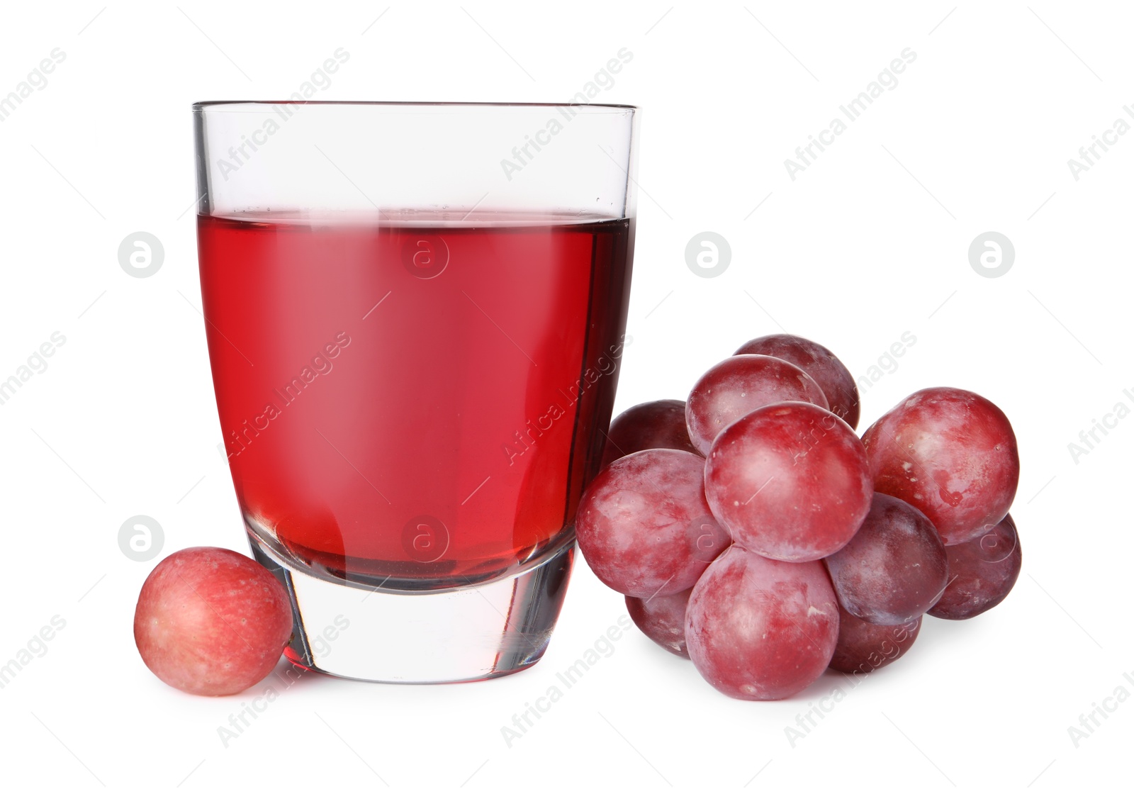 Photo of Tasty grape juice in glass and berries isolated on white