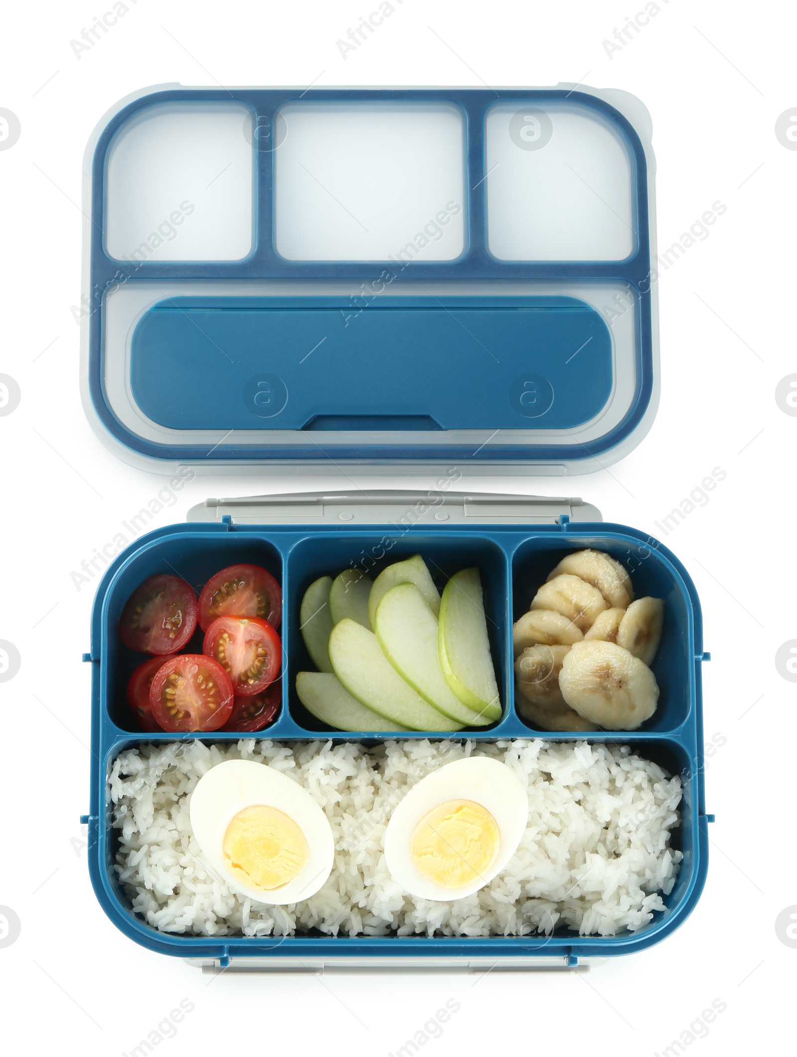 Photo of Lunch box with rice, fruits, tomatoes and egg halves isolated on white, top view