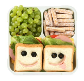 Photo of Sandwiches with smiley faces, grapes and cookies in lunch box isolated on white, top view