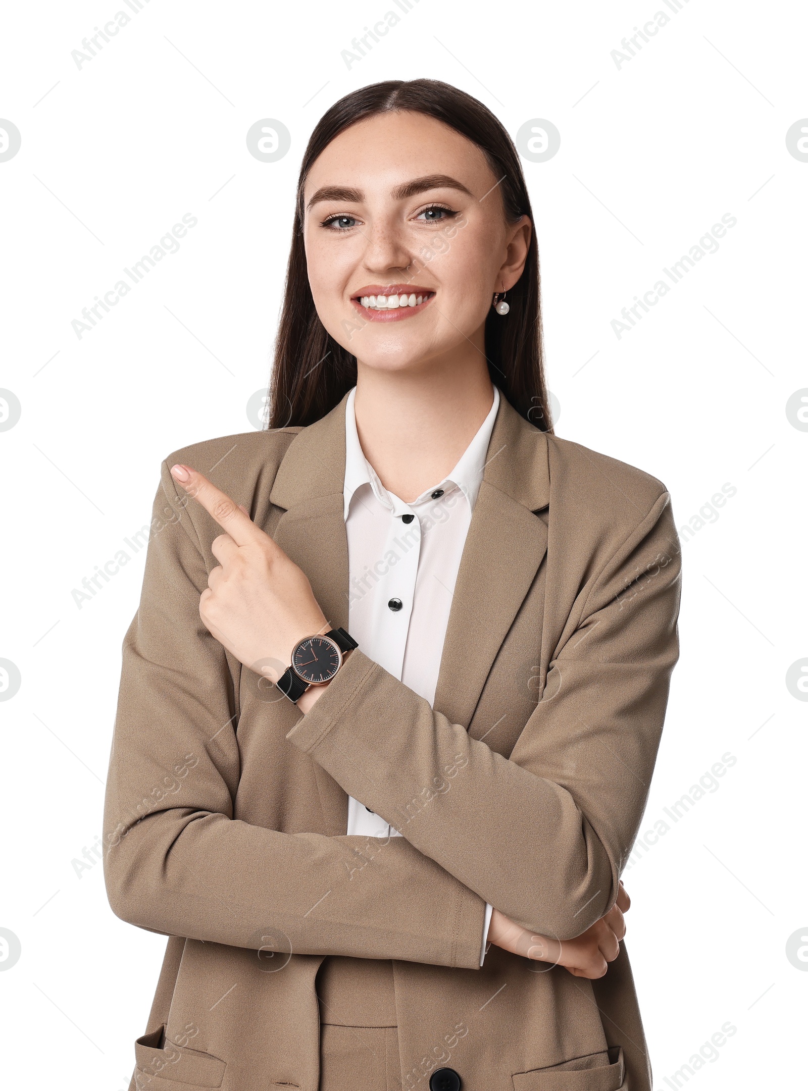 Photo of Beautiful woman in beige suit pointing at something on white background