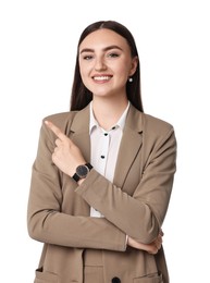 Beautiful woman in beige suit pointing at something on white background